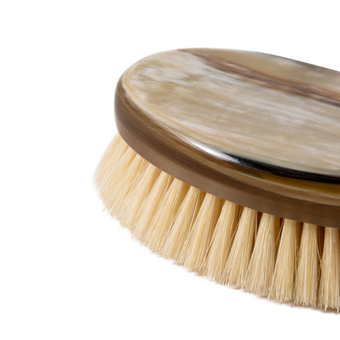 Detail of luxury natural horn hair brush with natural bristles – unique horn patterns, handmade in Italy.