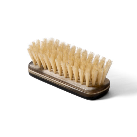 Close-up of the natural bristles on the horn shoe brush, ideal for gentle yet effective shoe care.