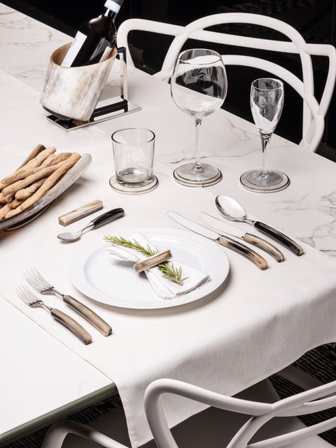 Luxury table accessories: cutlery, coasters, tray, napkin holder, oil & vinegar set, bowls, cutlery rest set, napkin rings, luxury vase, design vase and more. Zanchi, since 1952 Italian craftsmen of luxury decor in natural horn.