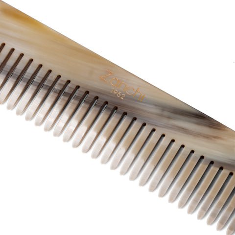 Close-up of luxury handcrafted natural horn pocket comb – premium Italian craftsmanship