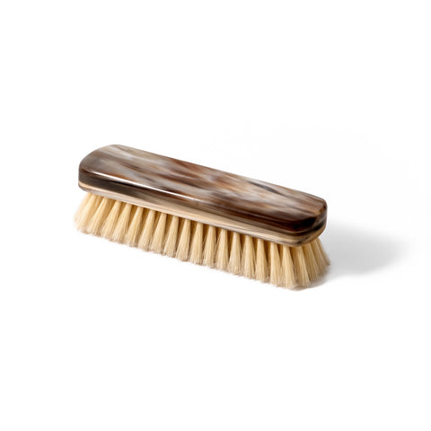 Front view of the natural horn clothing brush with natural bristles, handcrafted in Italy.